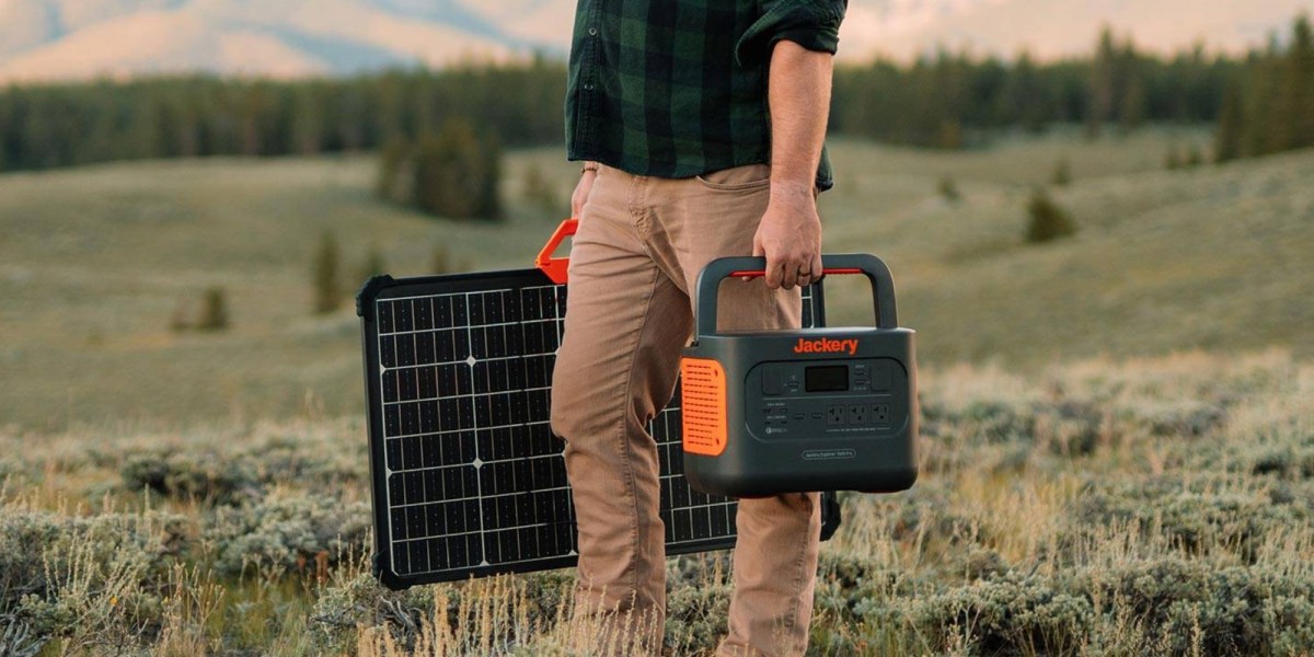 a man that is standing in the grass