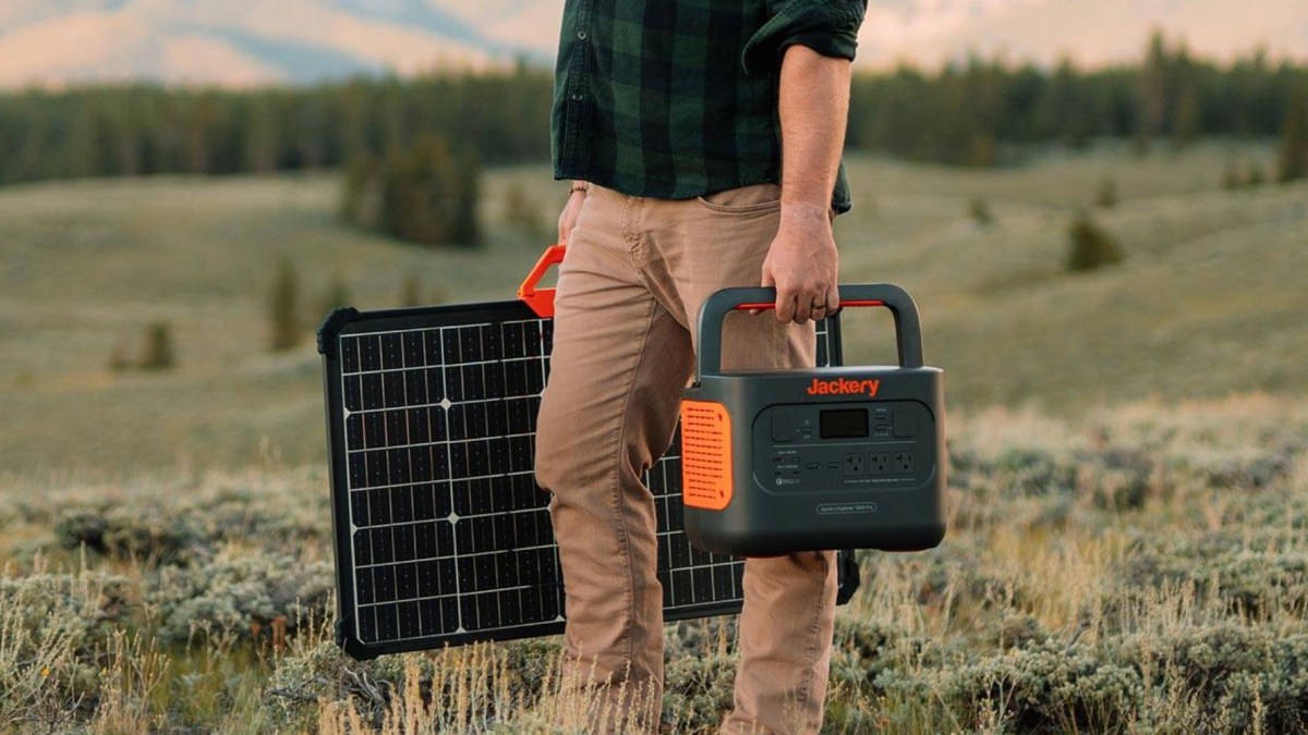 a man that is standing in the grass