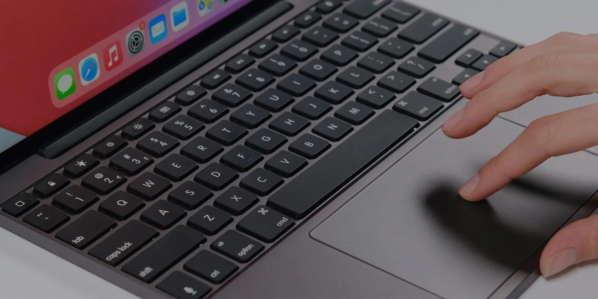 a laptop computer sitting on top of a keyboard