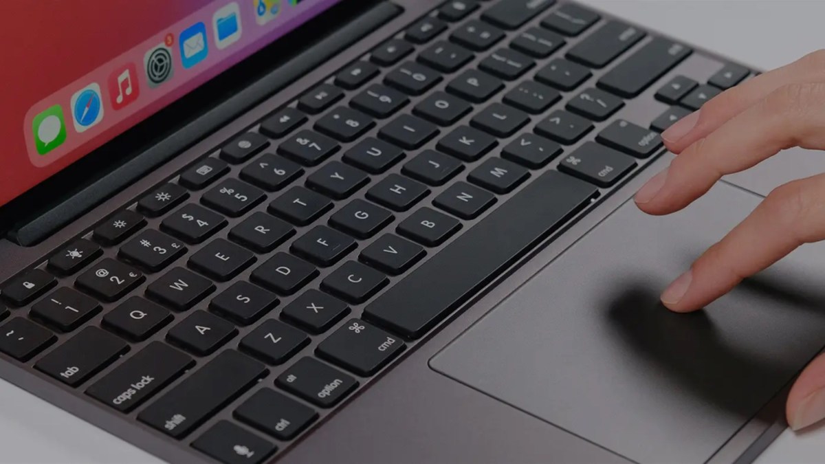 a laptop computer sitting on top of a keyboard