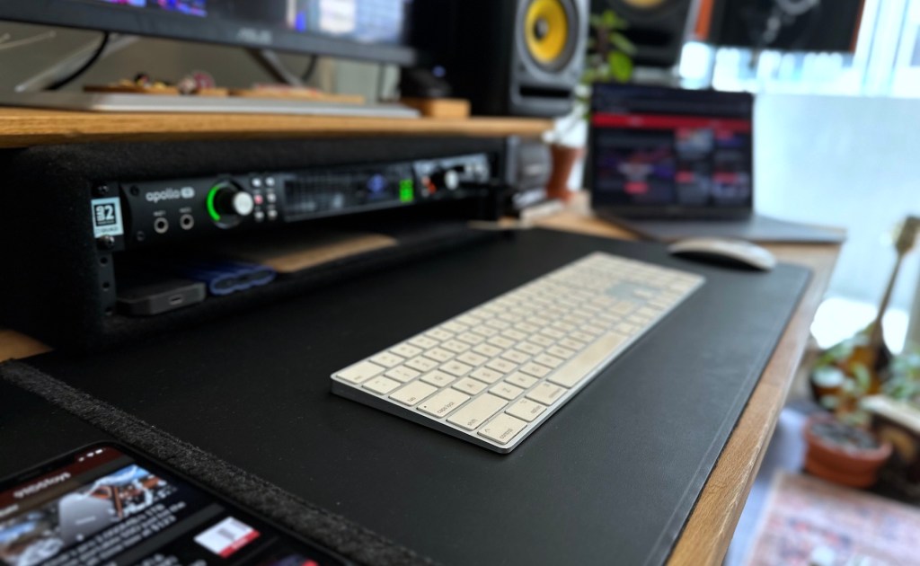 a laptop computer sitting on top of a desk