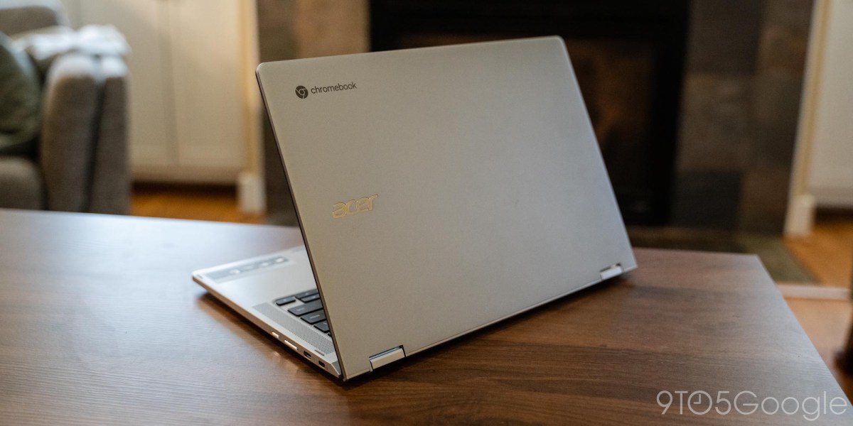 a laptop computer sitting on top of a wooden table