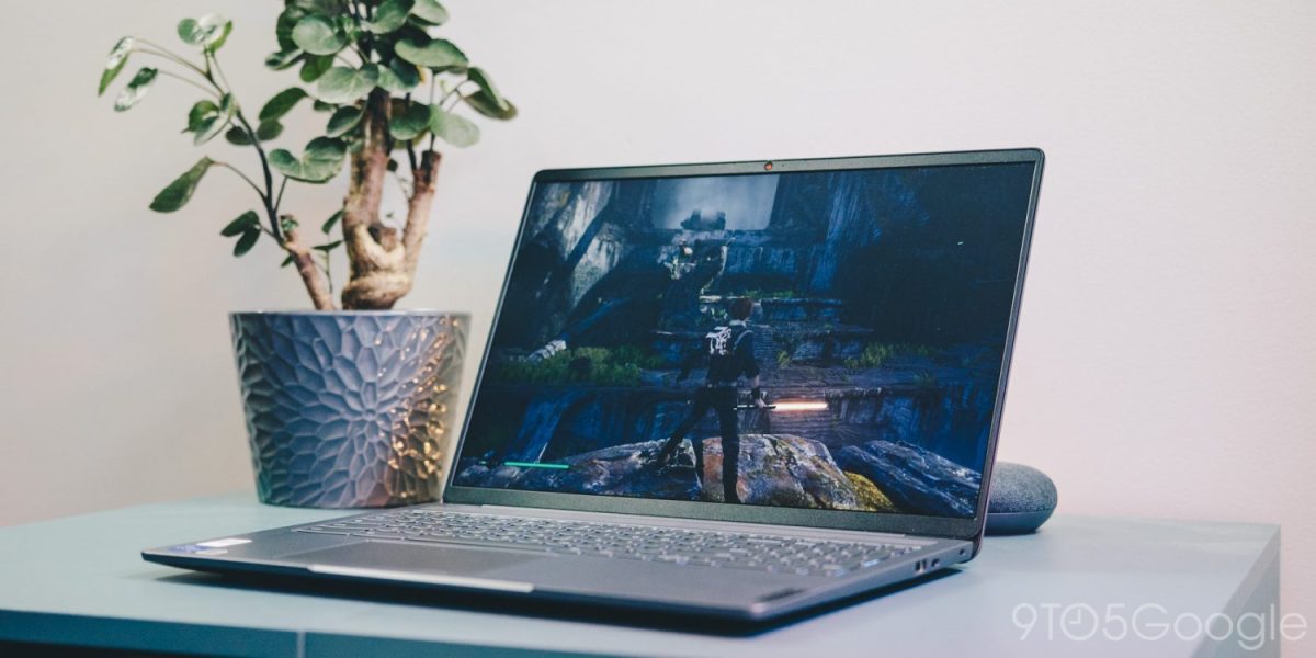 an open laptop computer sitting on top of a table