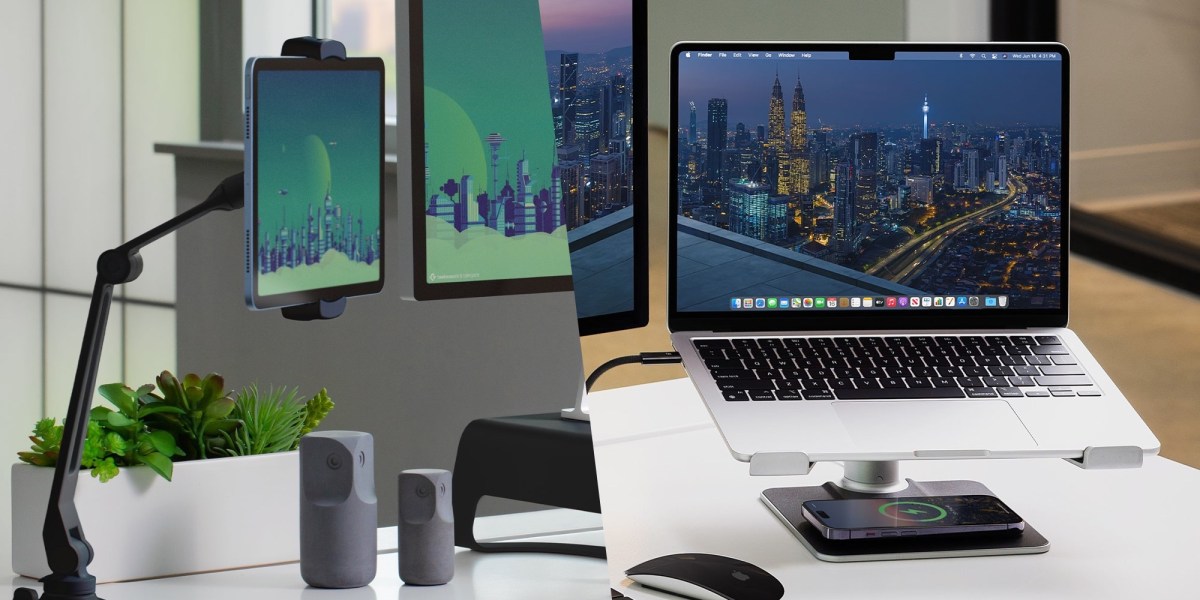 a desk with a laptop computer sitting on top of a table