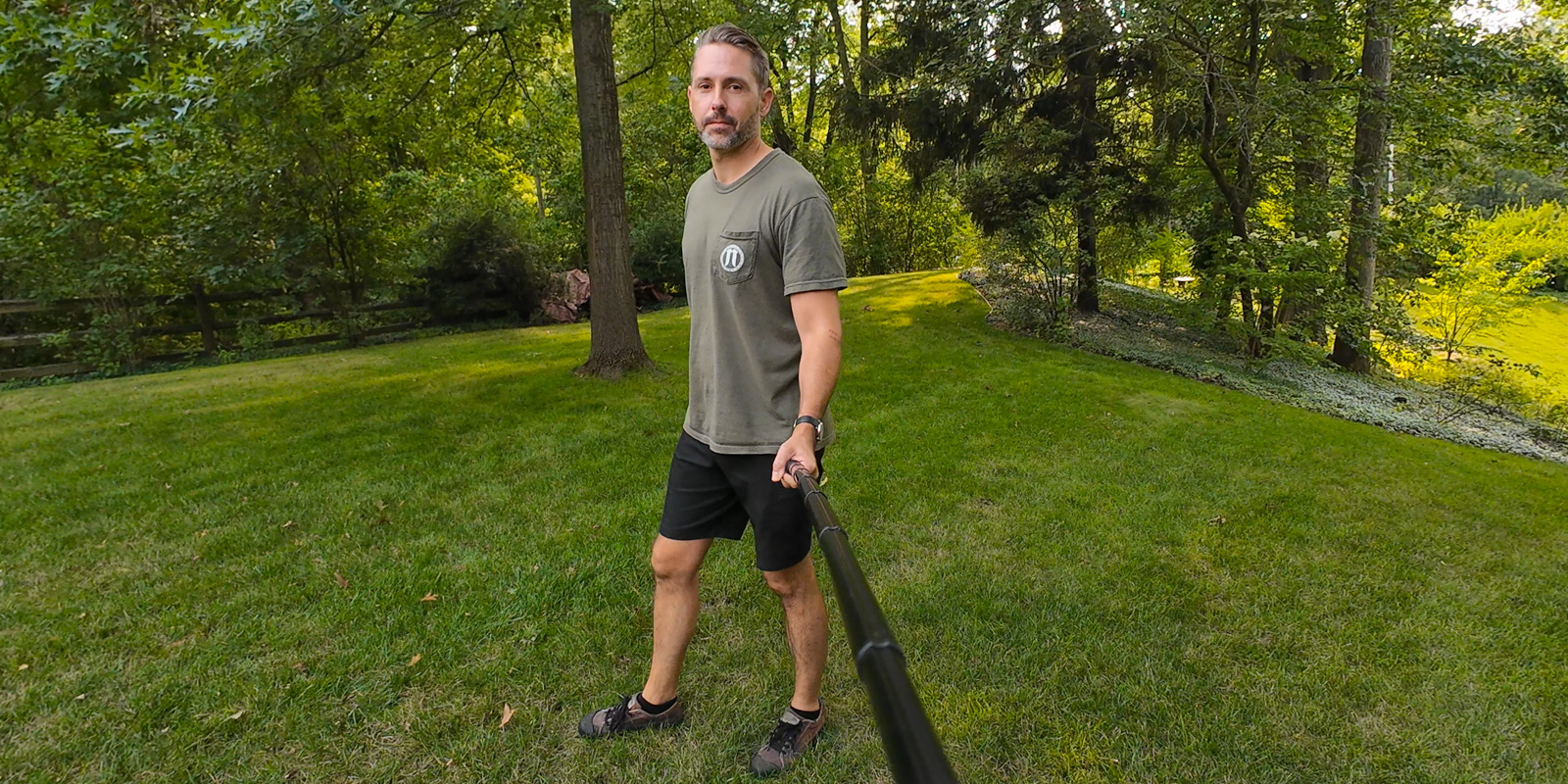 a man throwing a frisbee at the park
