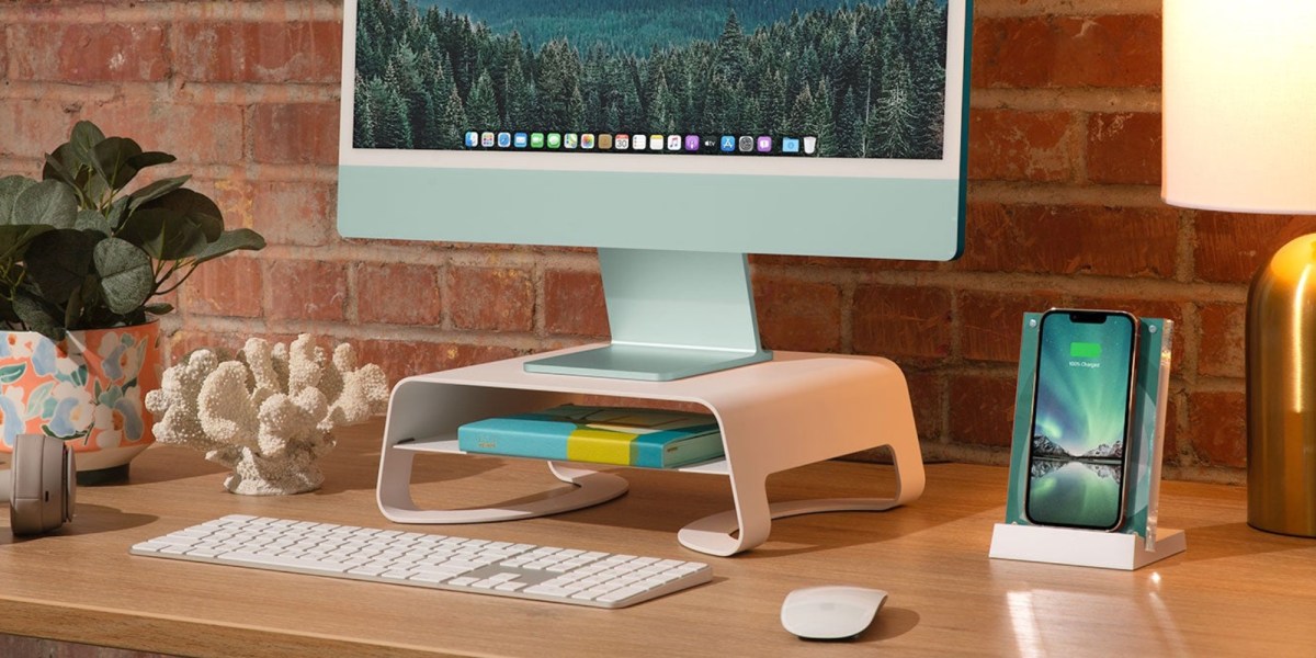 a desktop computer sitting on top of a wooden table