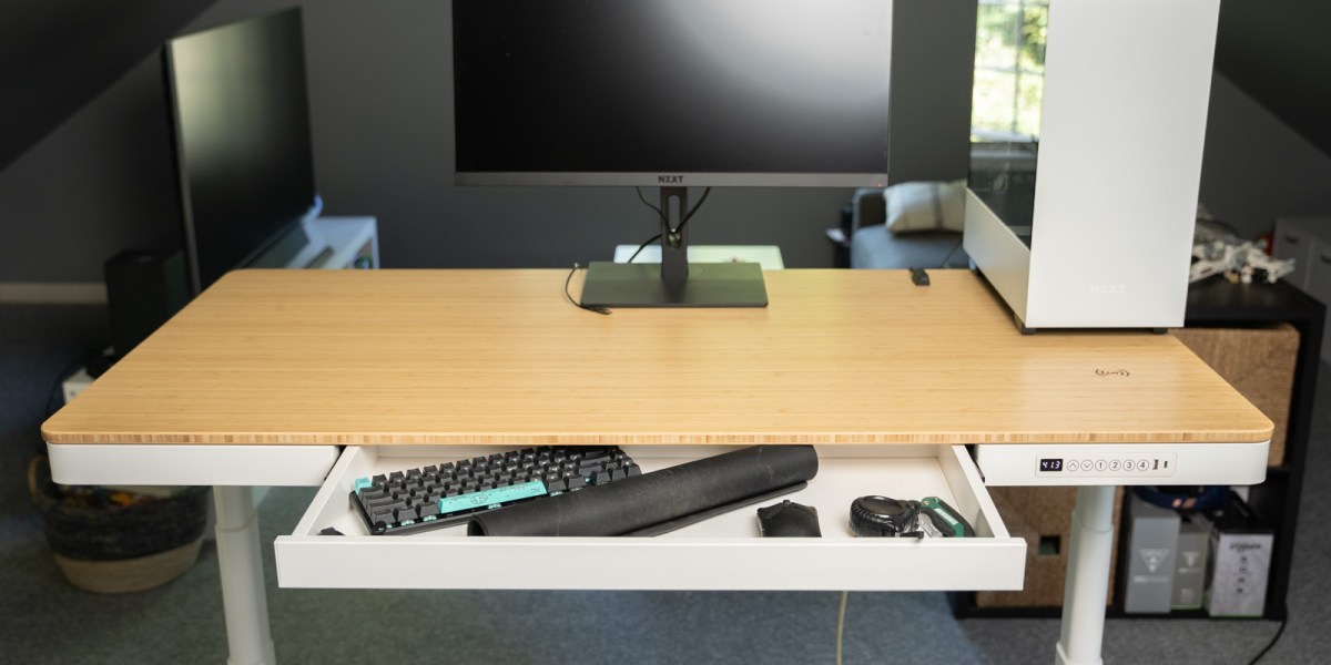 a desktop computer sitting on top of a wooden desk