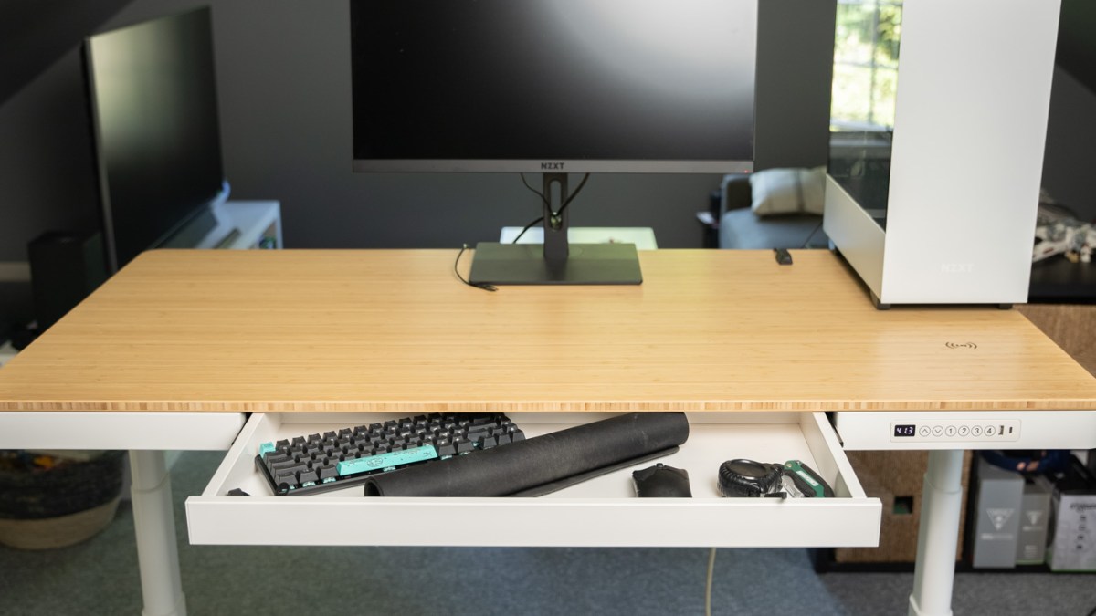 a desktop computer sitting on top of a wooden desk