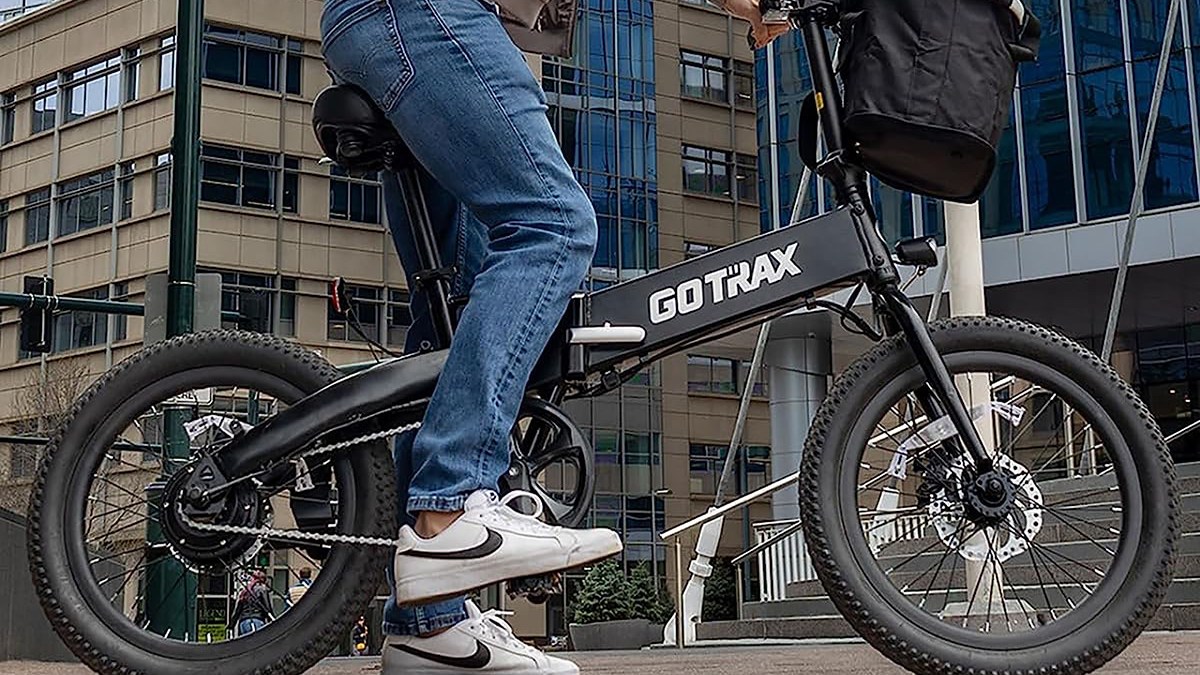 a man doing a trick on a bicycle