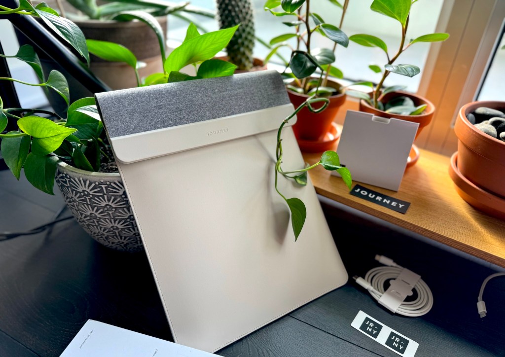 a vase of flowers sitting on a desk