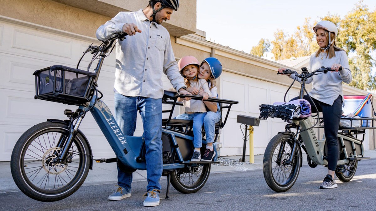 a man riding on the back of a bicycle