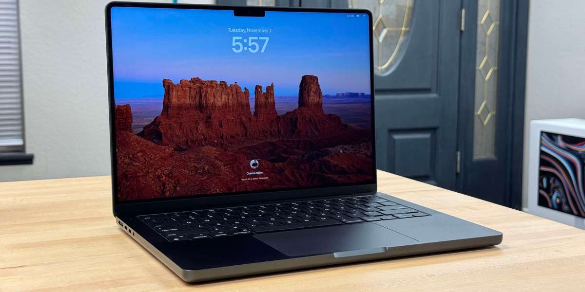 a laptop computer sitting on top of a table