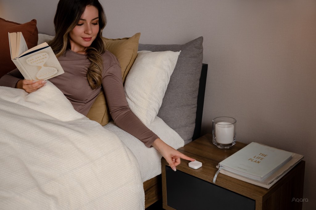 a woman sitting on a bed