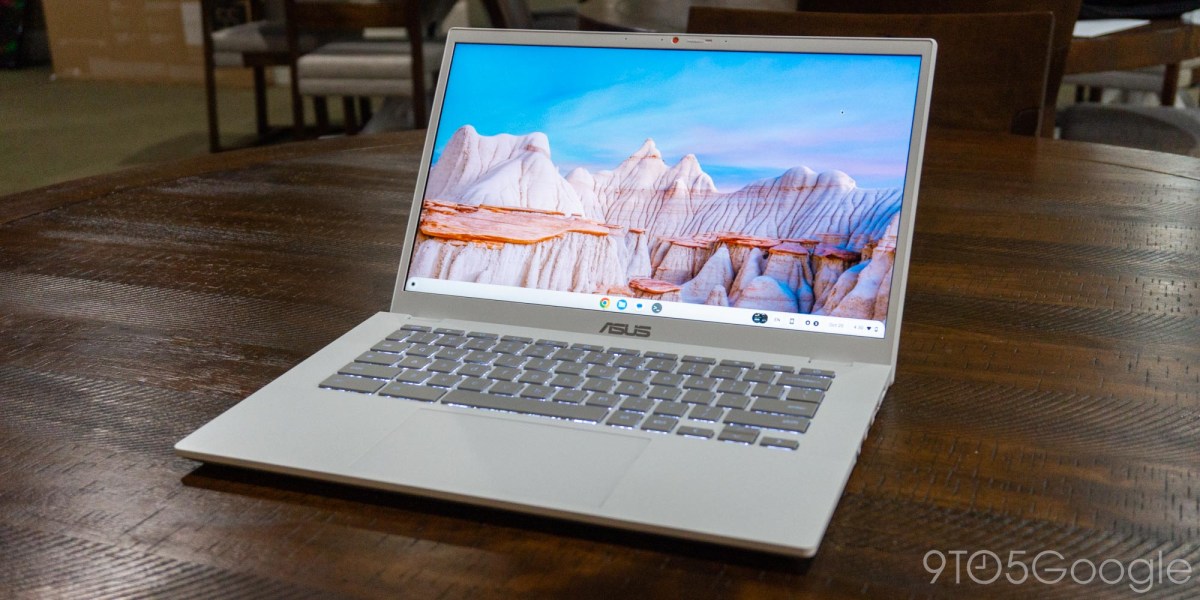 an open laptop computer sitting on top of a table