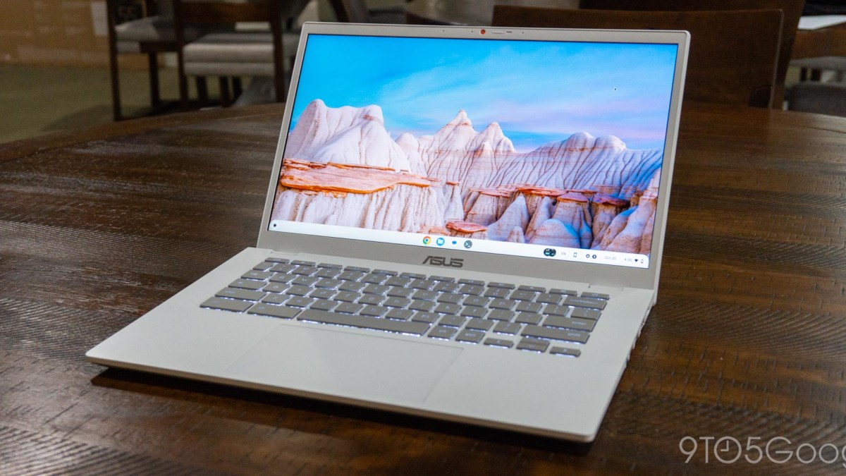 an open laptop computer sitting on top of a table