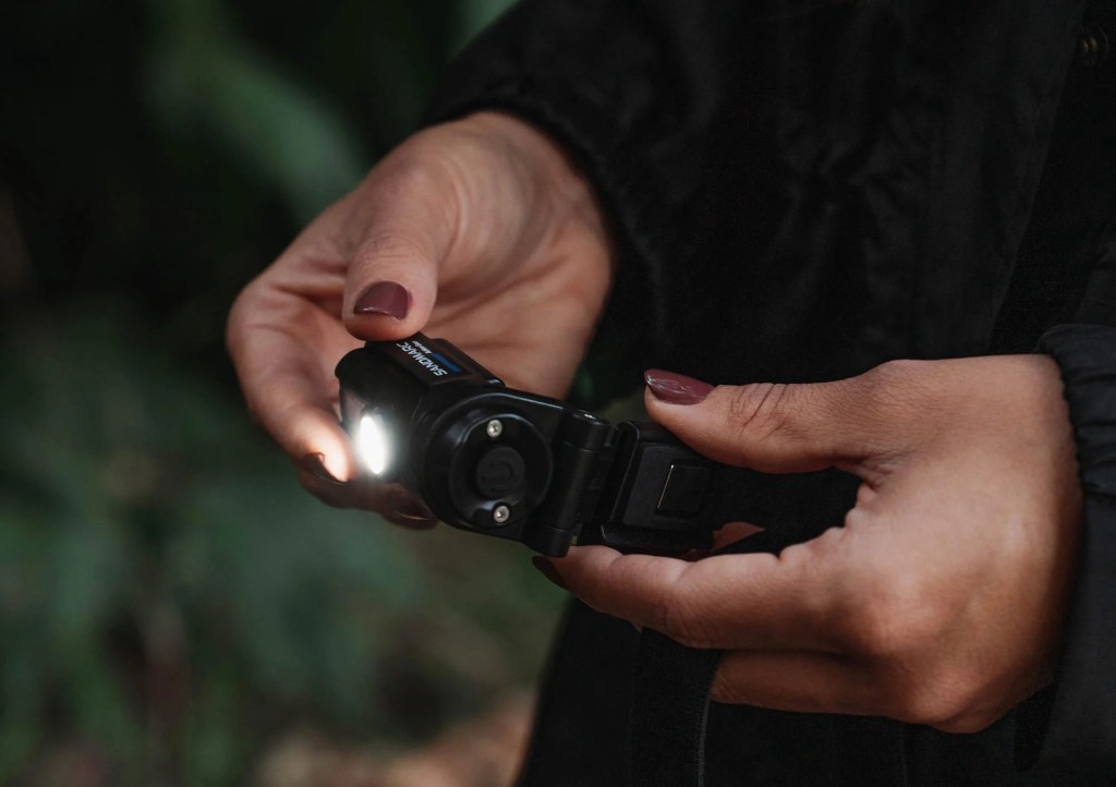 a hand holding a cell phone