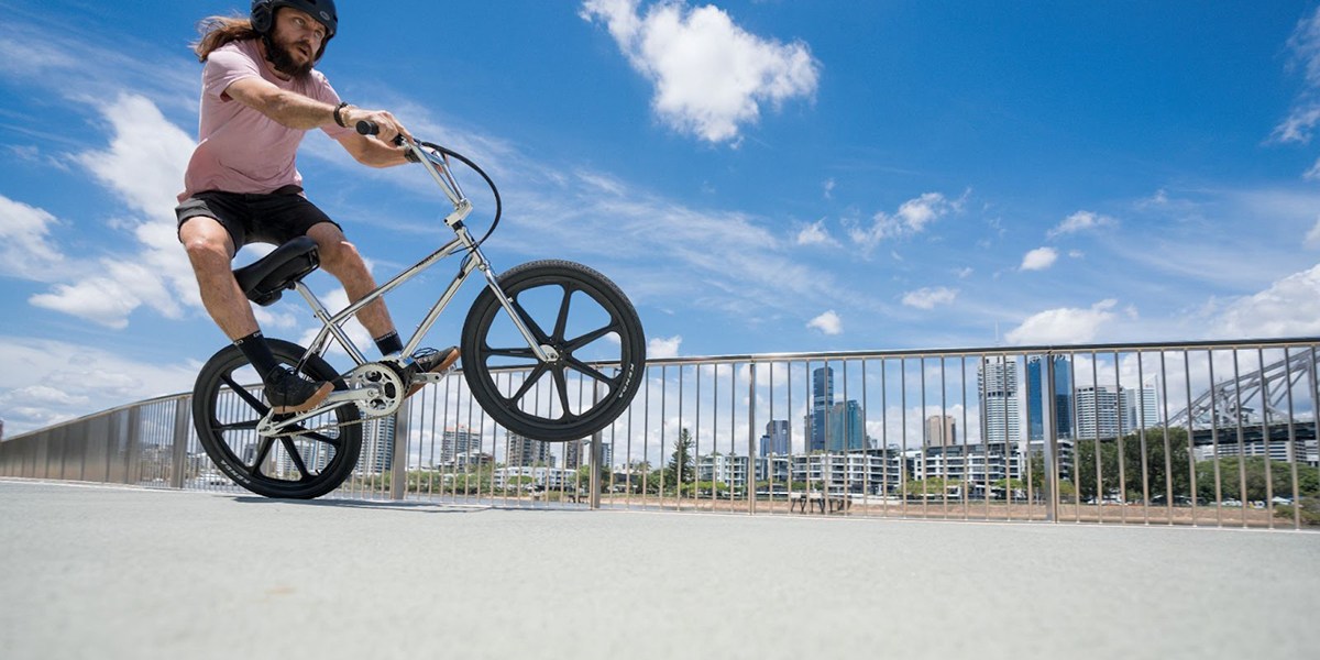 a man flying through the air while riding a bicycle