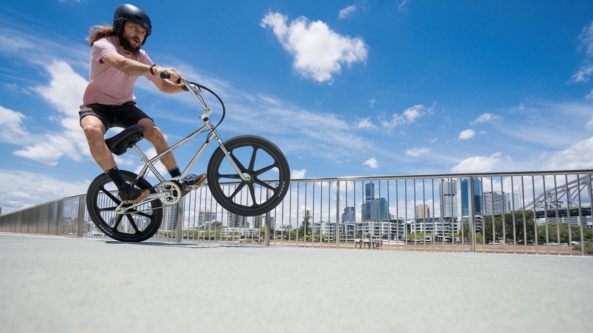 a man flying through the air while riding a bicycle