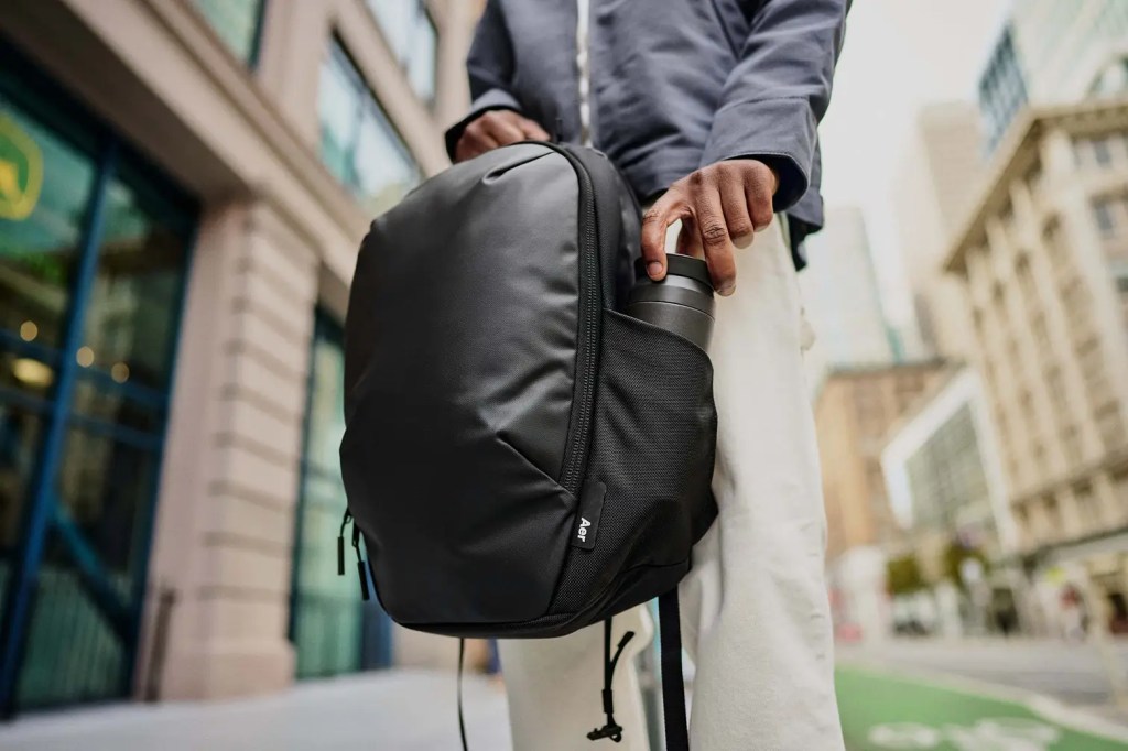 a man standing on a sidewalk