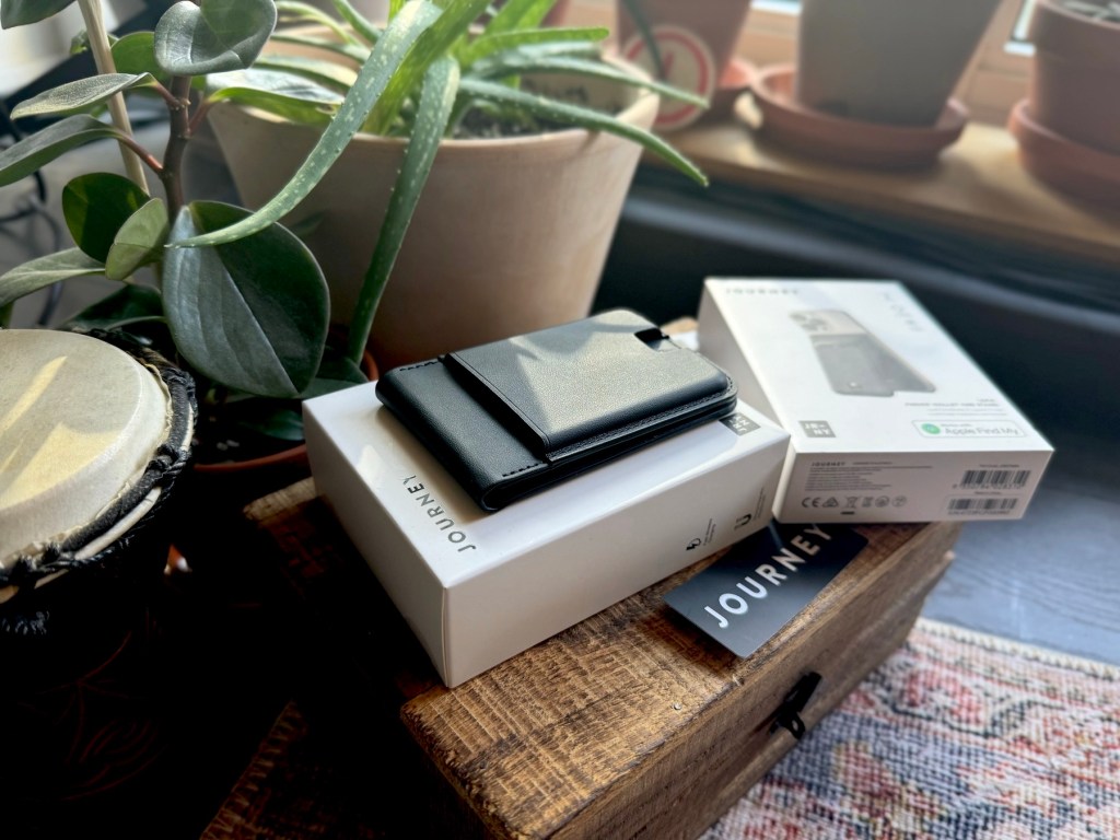 a laptop computer sitting on top of a wooden table