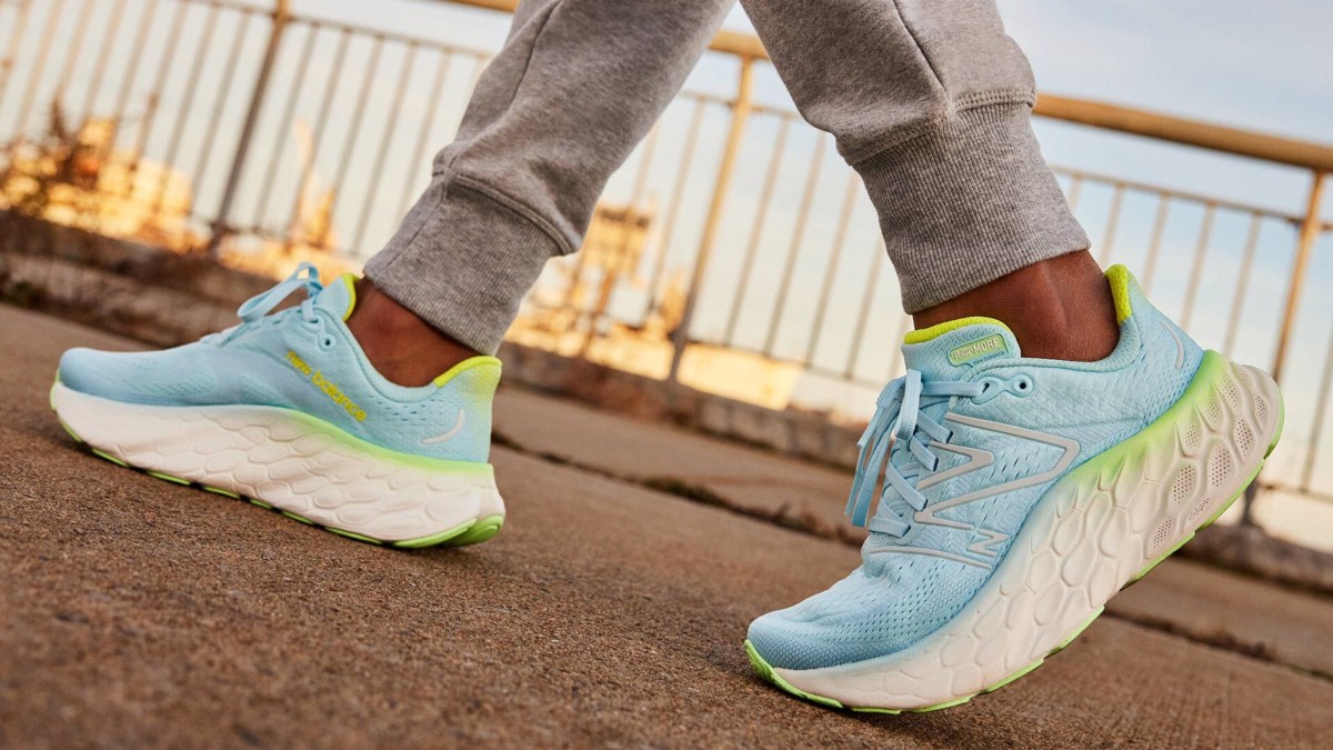 a close up of feet wearing blue shoes