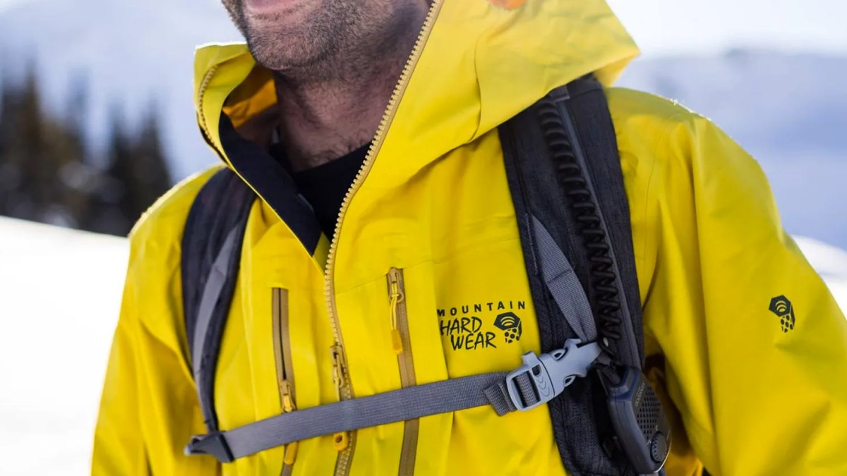 a man wearing a yellow jacket