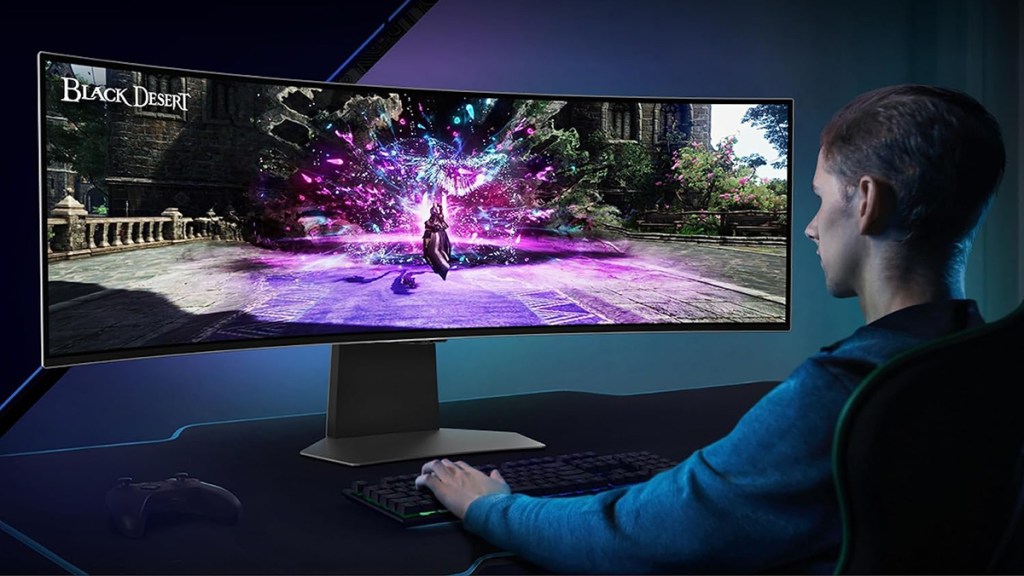 a man sitting at a desk in front of a computer screen