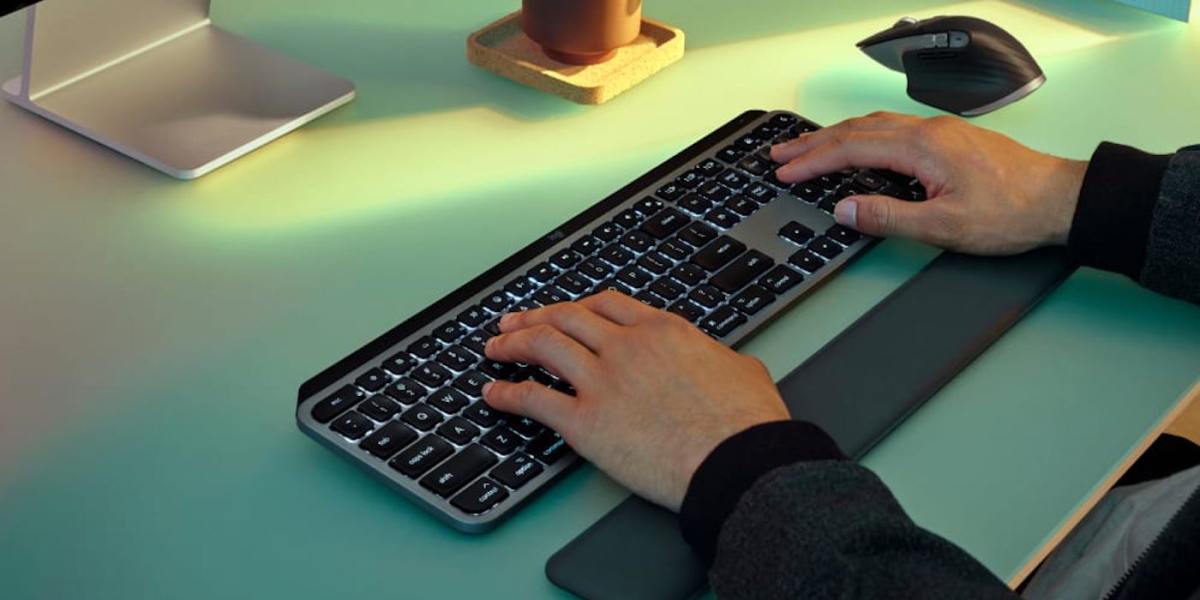 hands typing on a keyboard