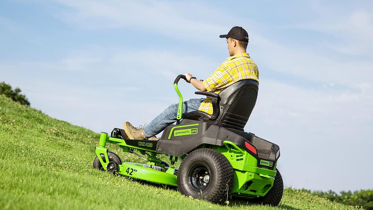 a man riding a lawn mower