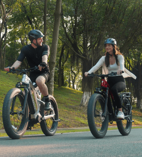 a man and a woman riding bikes