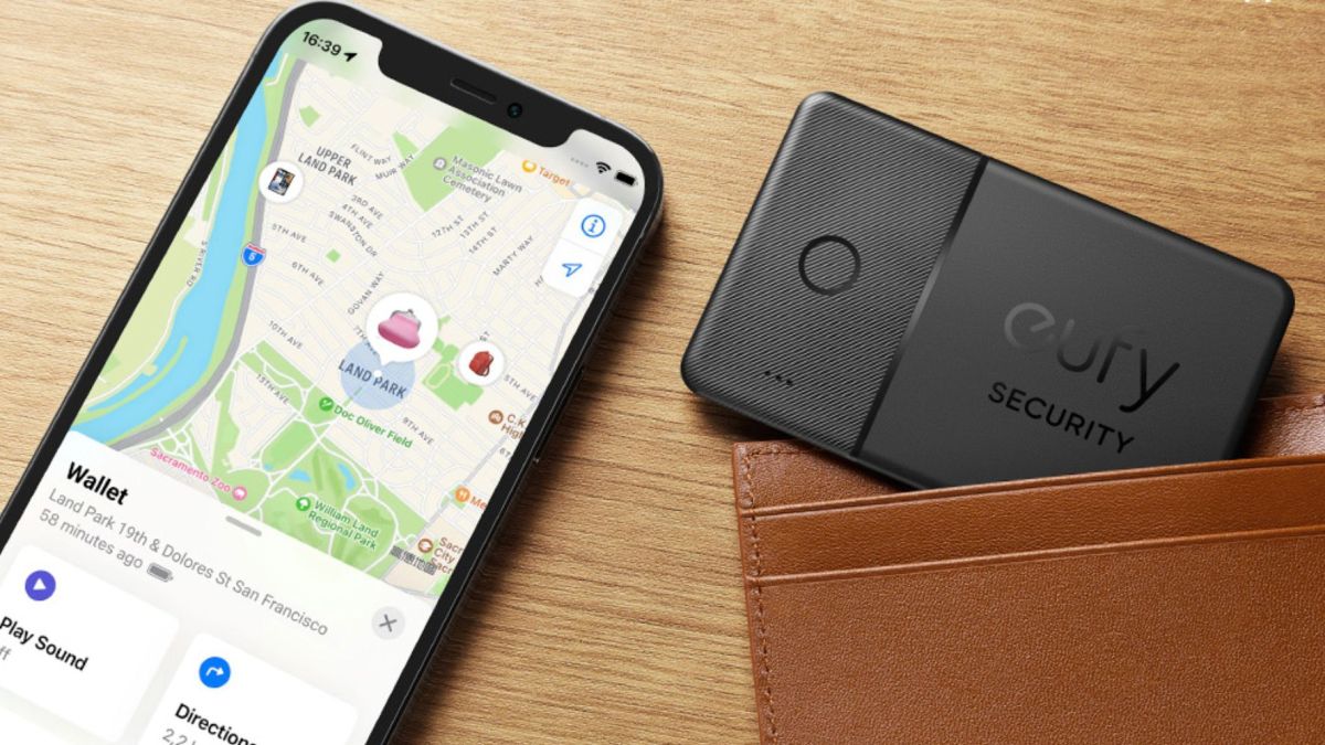 Anker eufy SmartTrack card in a wallet next to an iPhone tracking it.