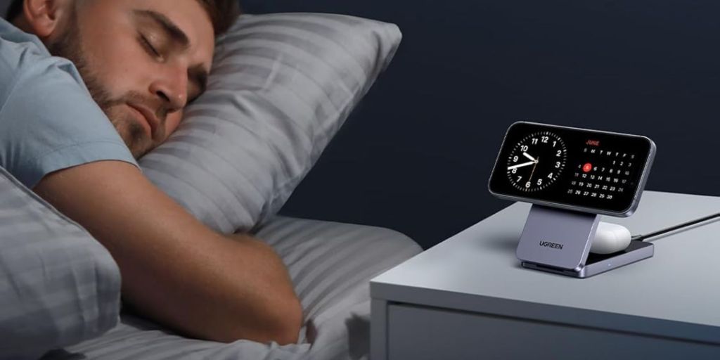 Image showing a person sleeping next to a MagSafe charger holding an iPhone.