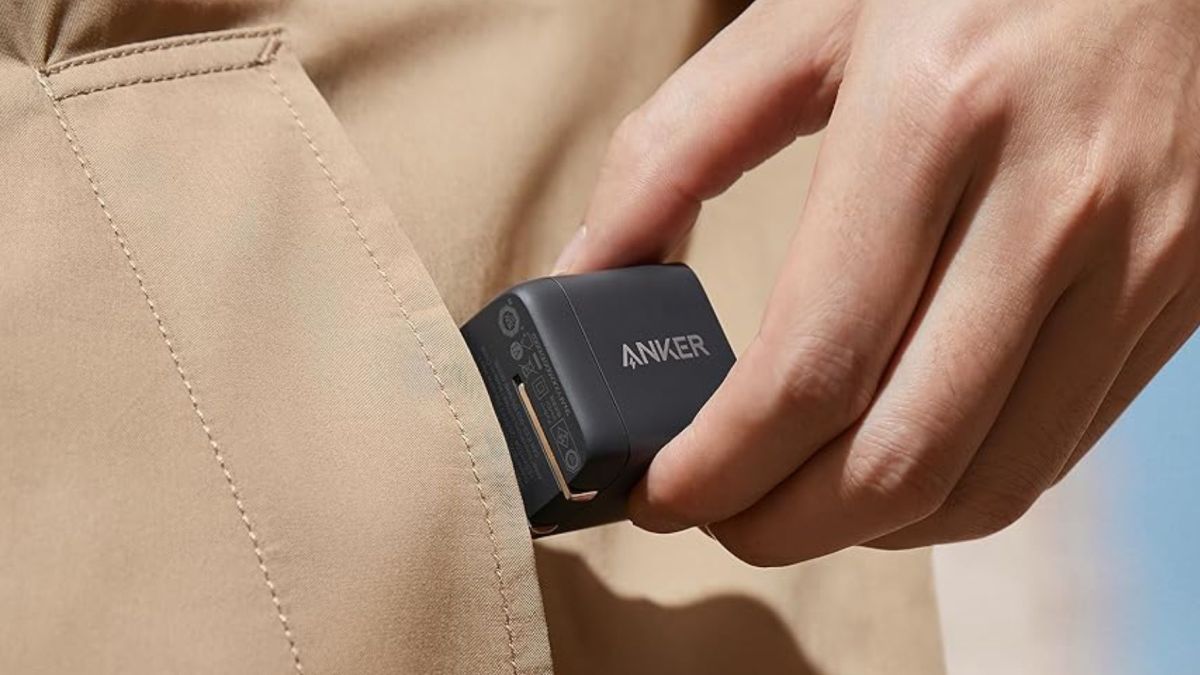 Image showing a person putting Anker's USB-C charger in their pocket.