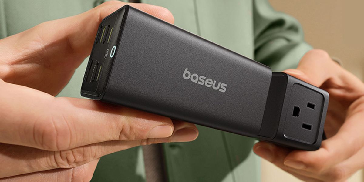 Image showing a person using Baseus' 100W detachable charger.