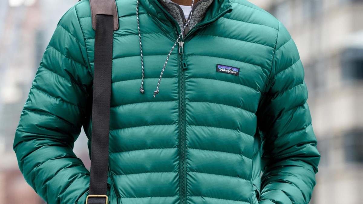 a person wearing a green jacket