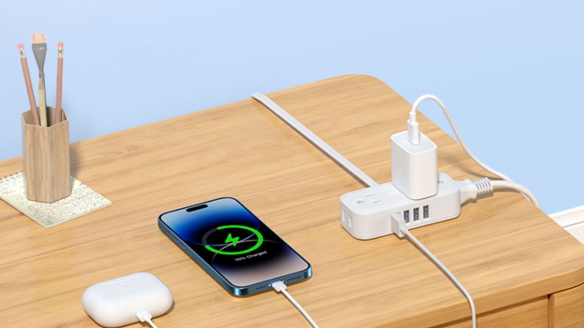 Image showing a power strip charging an iPhone and AirPods.