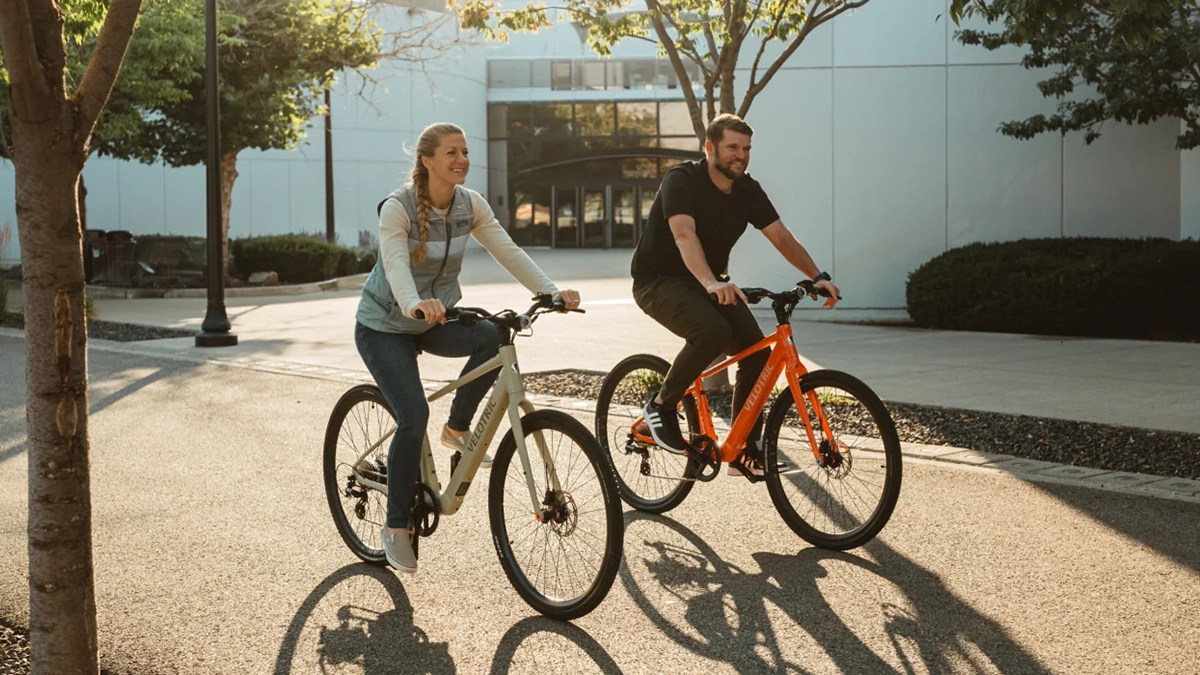 a man and a woman riding bicycles