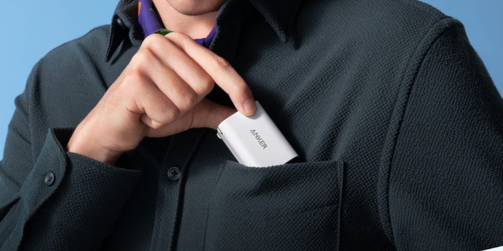 Image showing a person sliding Anker's 100W Nano USB-C charger into their pocket.