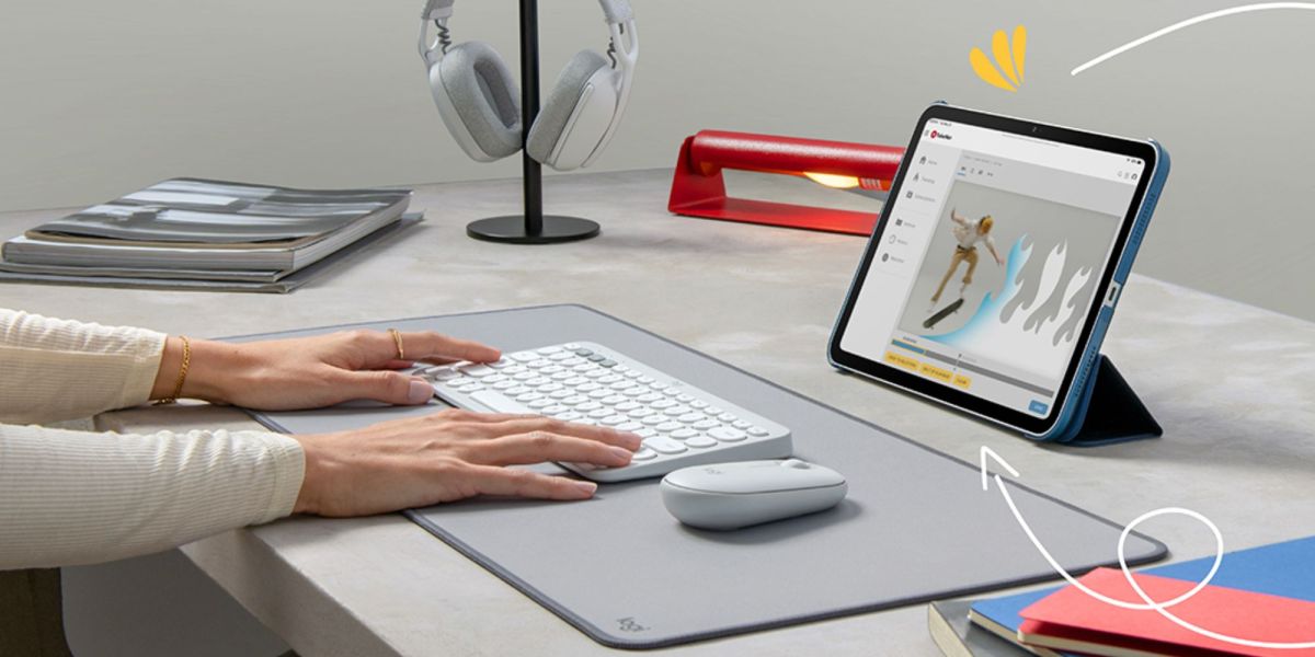 Image showing a person using Logitech's Pebble 2 Keyboard and mouse.