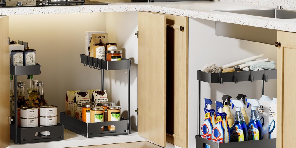 A kitchen counter with a cupboard and a door open