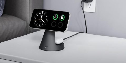 A smart phone charging on a charging station