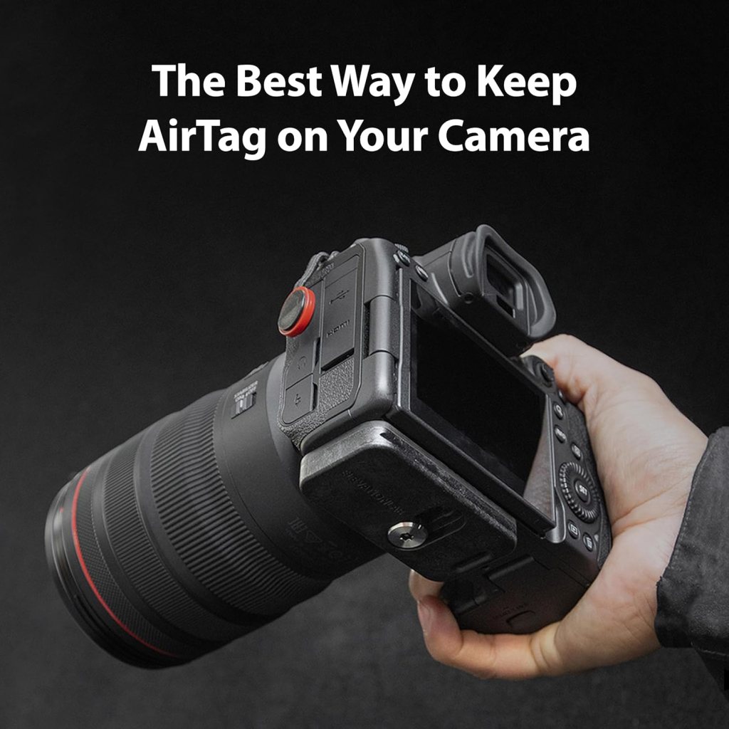 A hand holding a camera