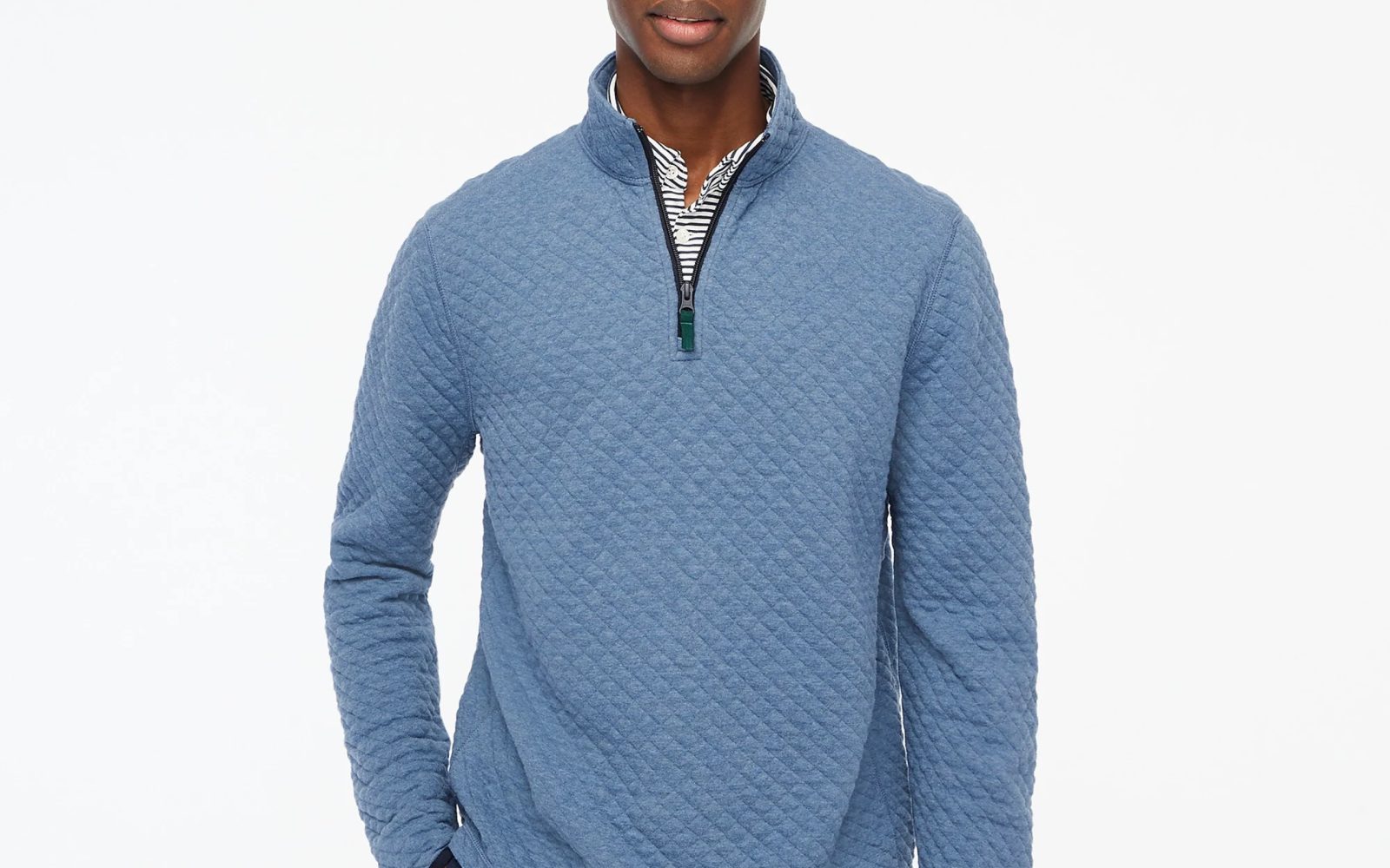 A man wearing a blue sweater