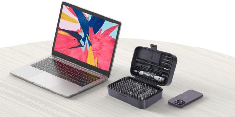 A laptop with a tool box and a phone