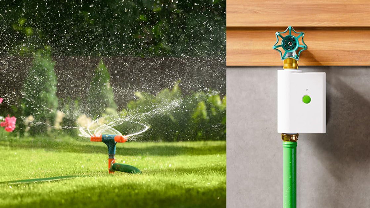 A sprinkler spraying water on grass