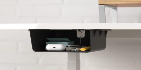 A white desk with a black shelf and a white object