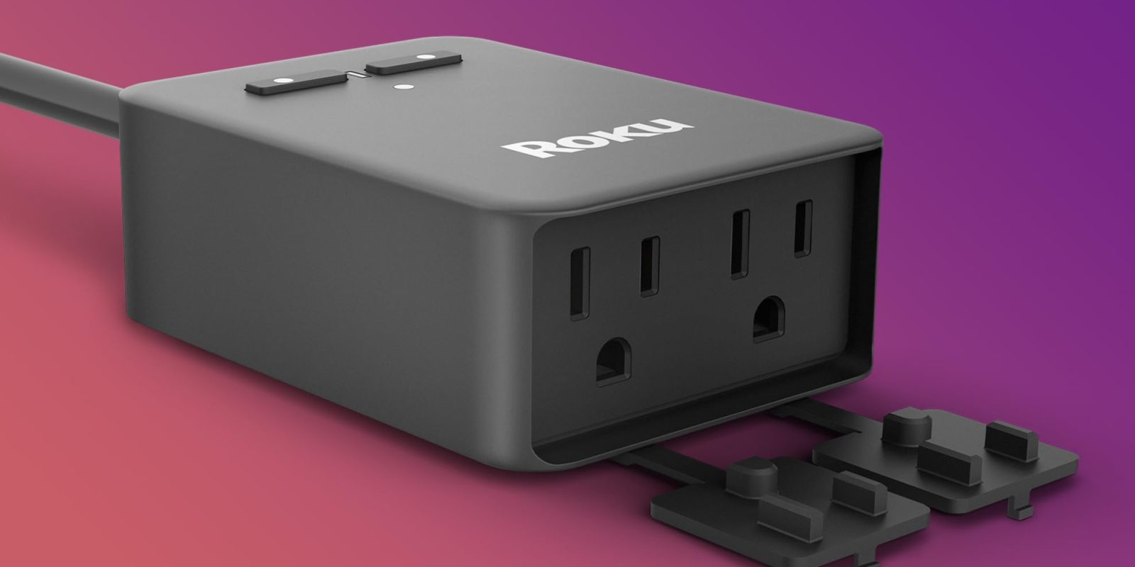 A black electrical outlet with a plug in
