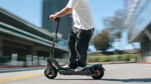 A person riding a scooter