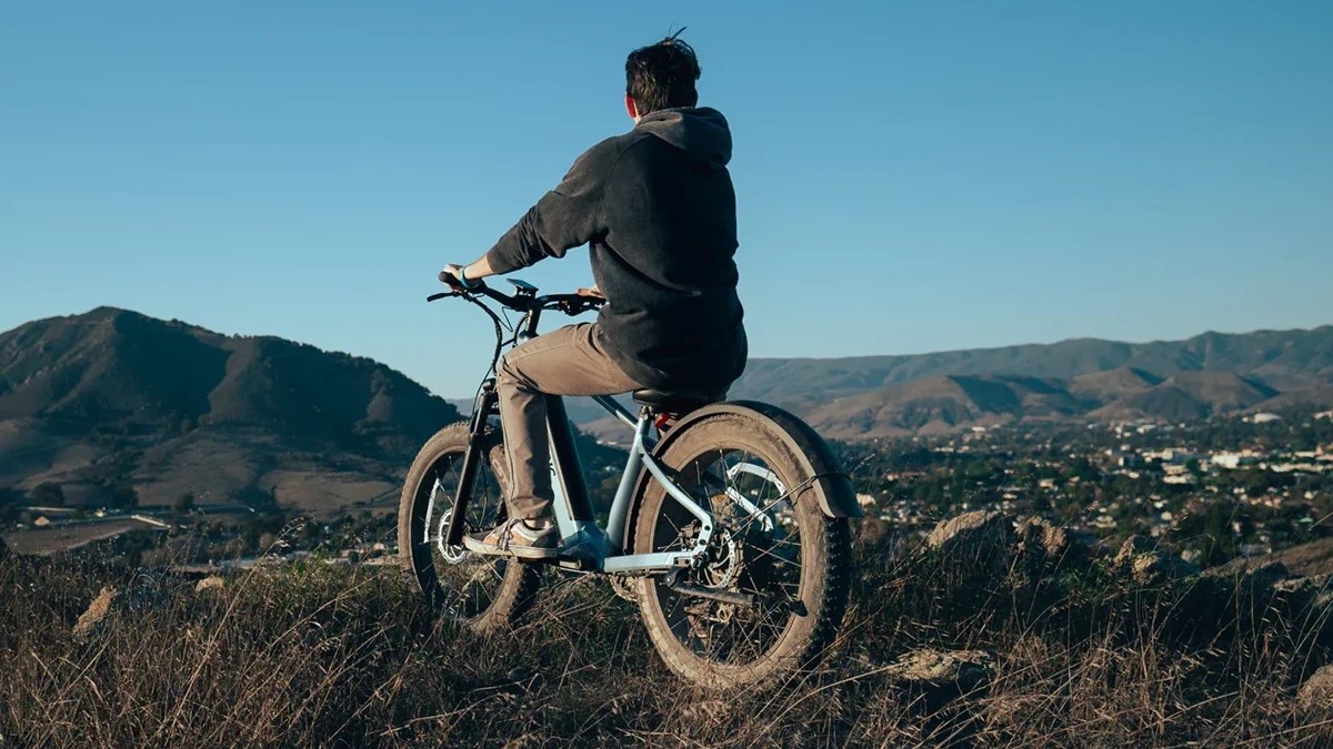 A man riding a bike on a hill
