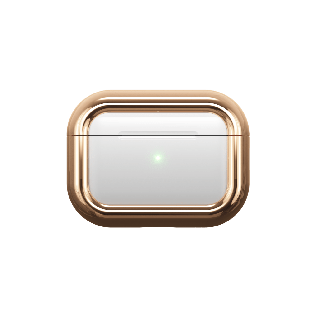 A gold and white device with a green light